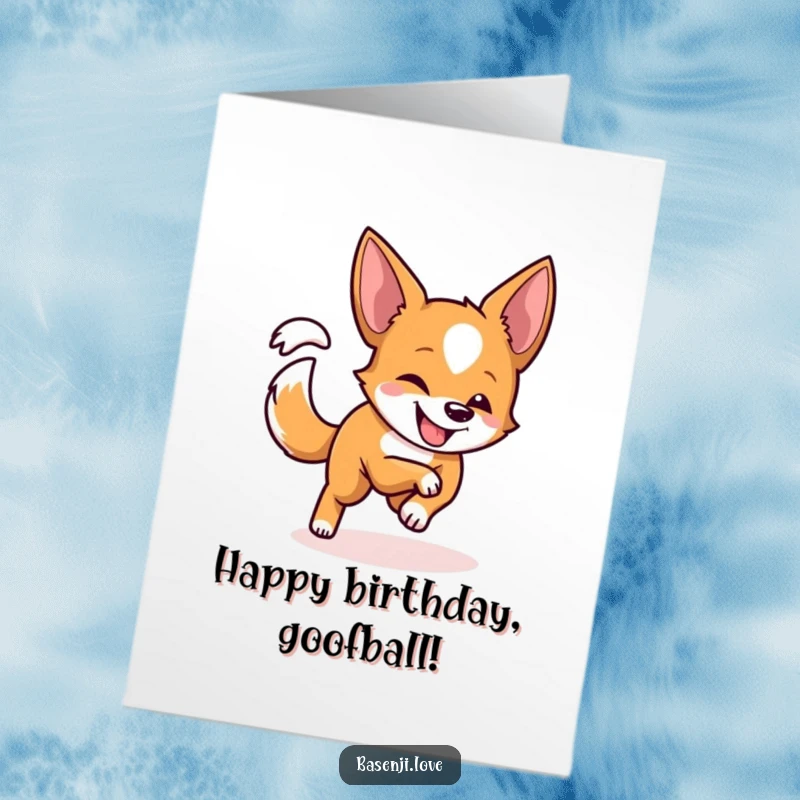 Funny free printable birthday card: A Basenji with a playful grin excitedly chases its tail in a dizzying circle.